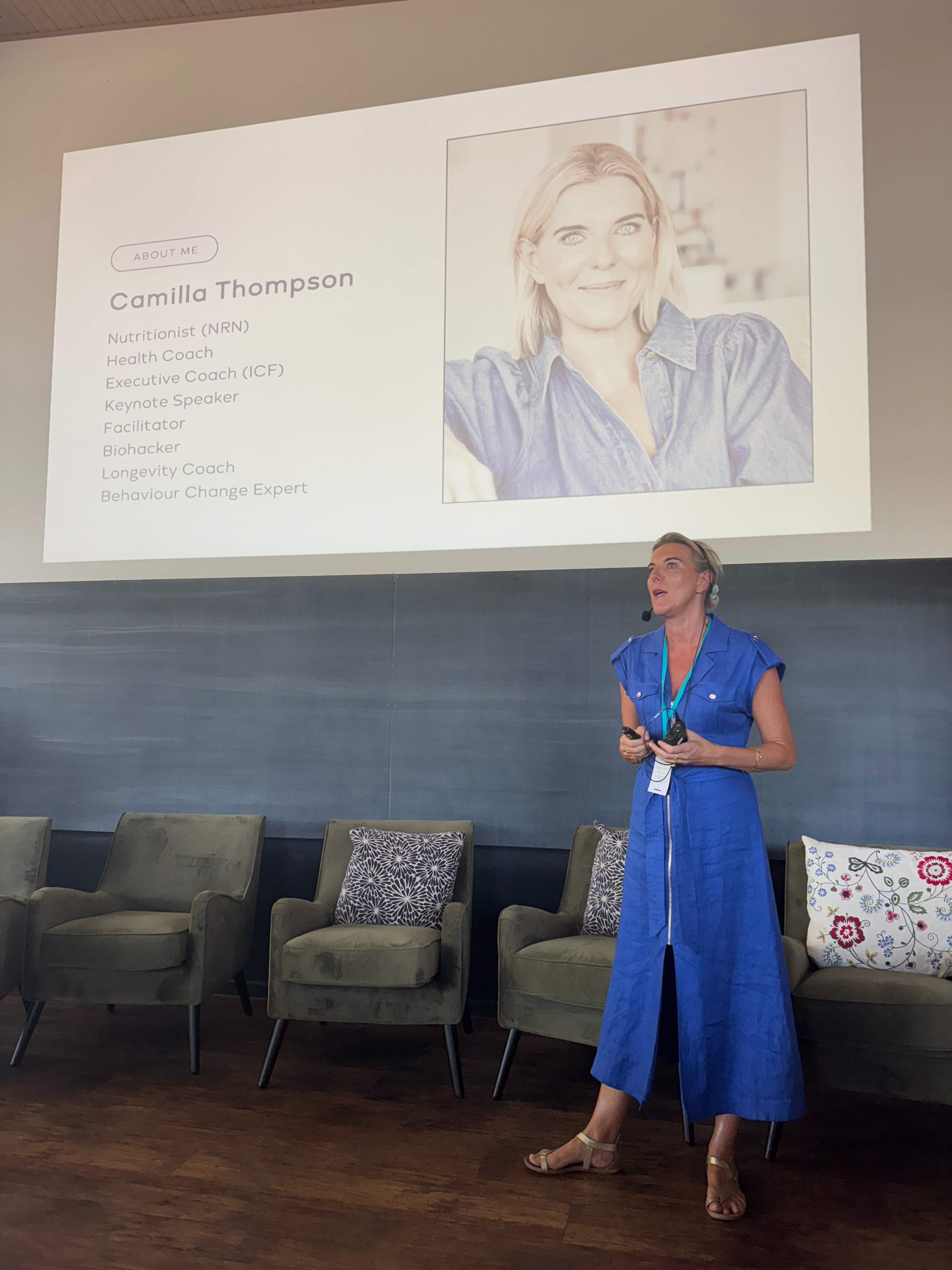 Camilla presenting on stage